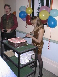 Sat -  Christina cutting cake